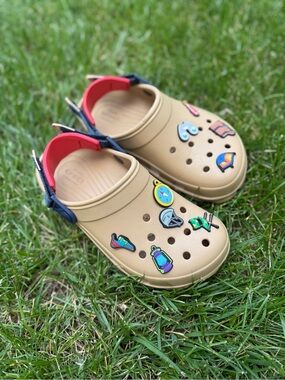 CROCS Tan Slip-On Clogs with Navy & Red Heel Straps and Colorful Charms